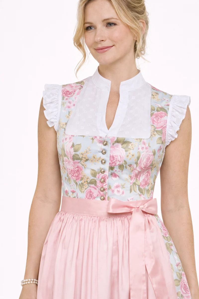 Dirndl aus Rosendruck mit aufgesetzten Bändern
